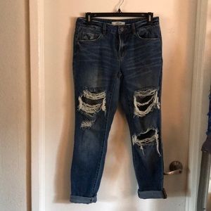 Ripped, dark blue boyfriend style jeans